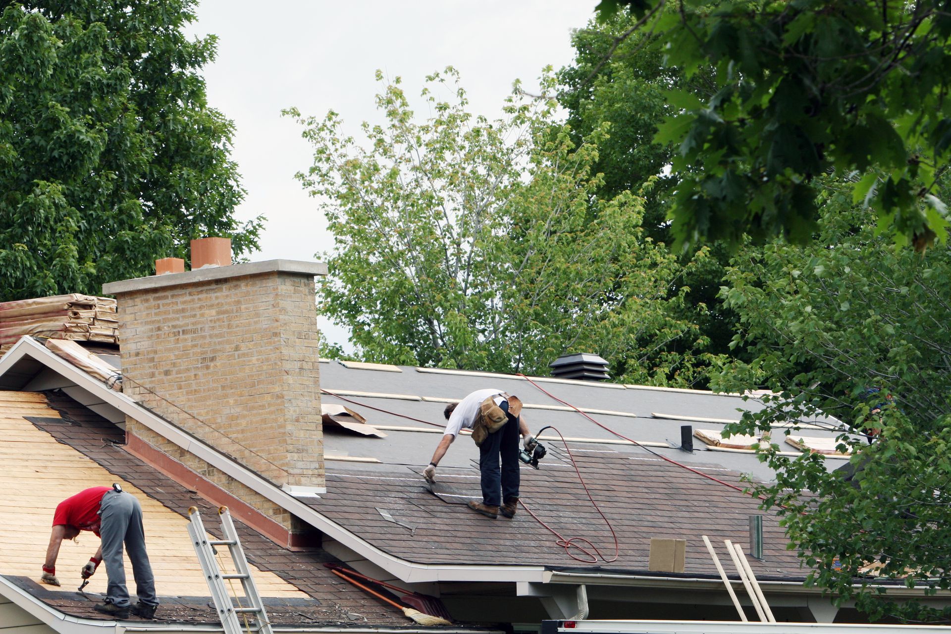 Experienced roofers working on professional roof repair services.