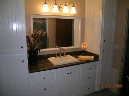 A bathroom with a sink and a mirror taken on december 22 2006
