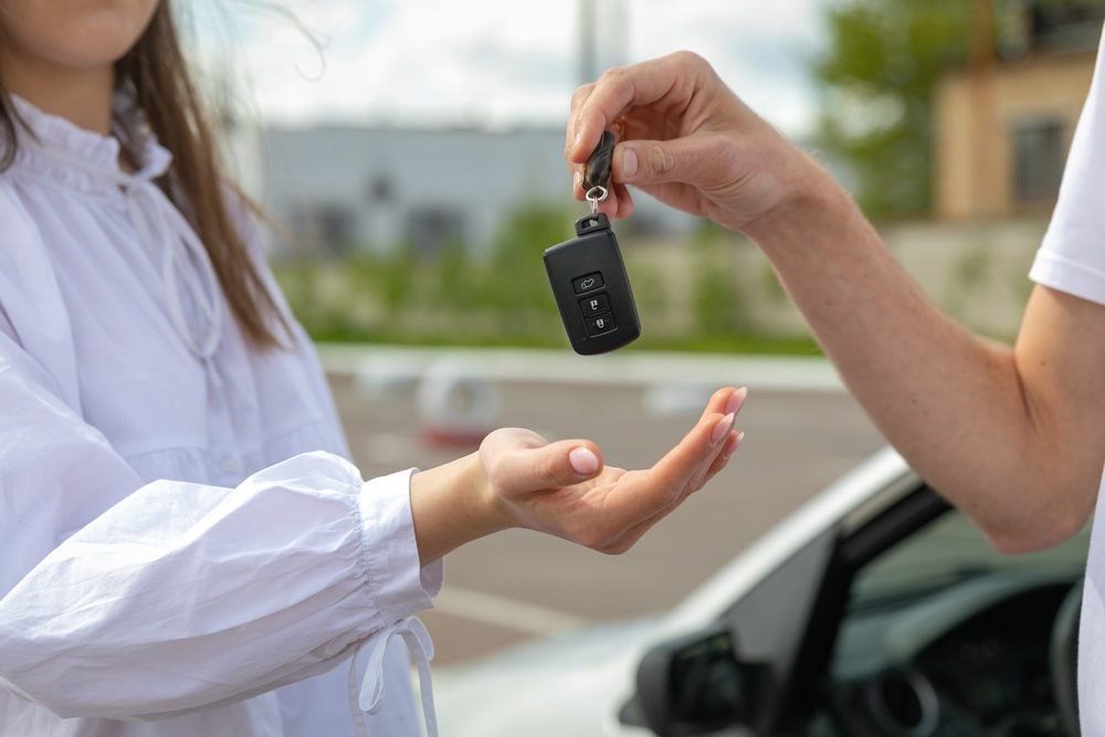 Examiner Giving The Key To The Student — L2Drive Driving School in Warwick, QLD