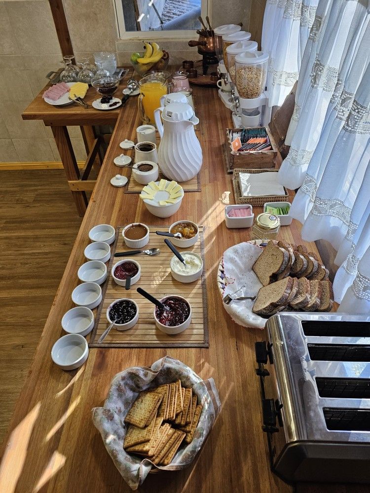 There is a buffet table with a lot of food on it.