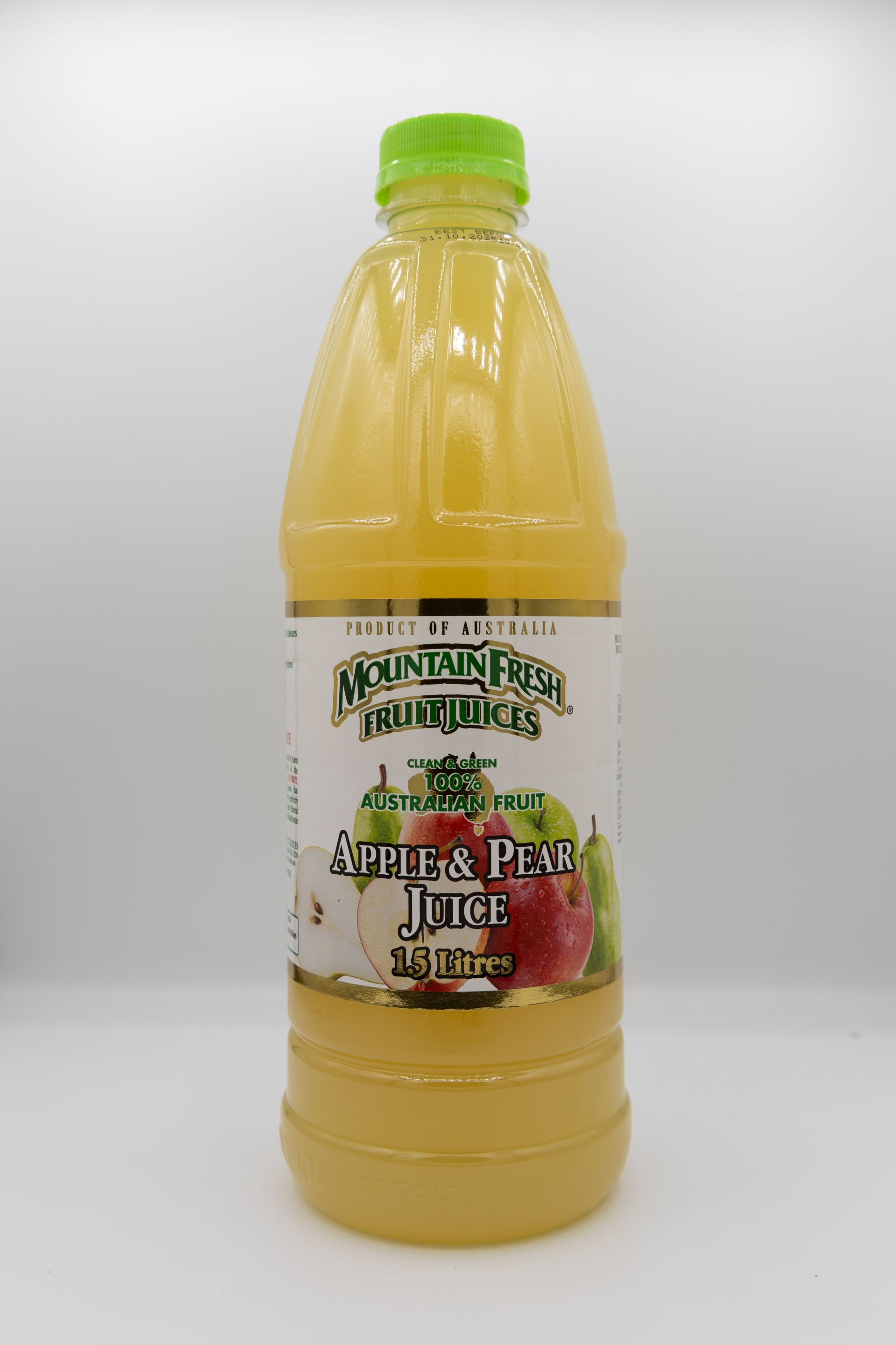 Bottle of yellow apple juice with a green cap and apple label on a white background