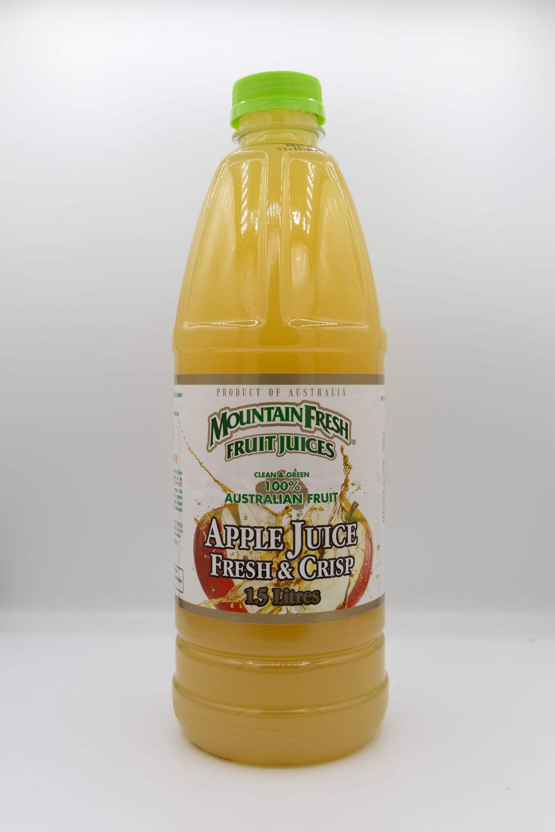 Bottle of amber apple juice with a green cap and label against a white background