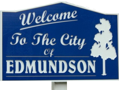 A blue sign that says welcome to the city of edmundson