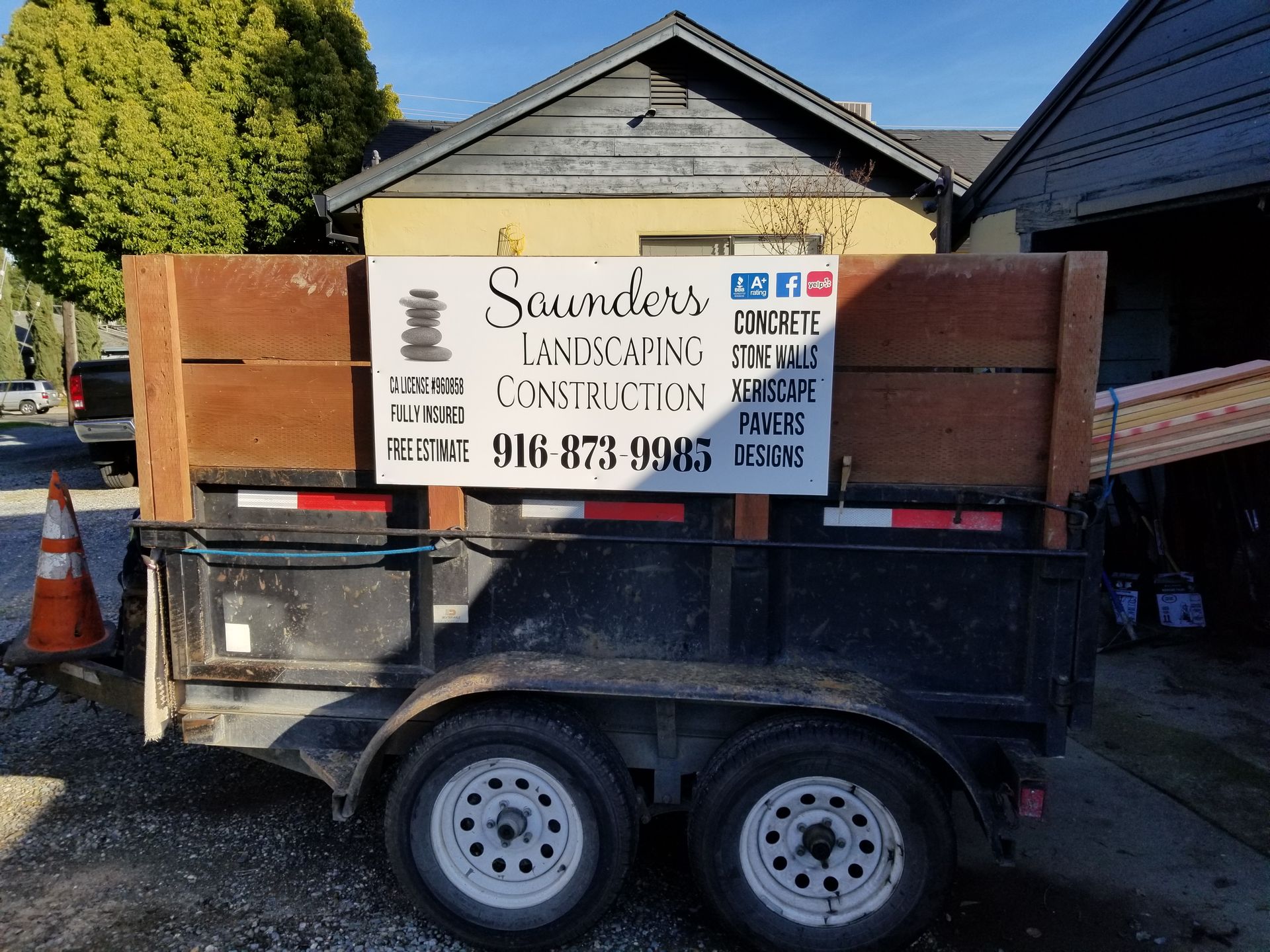 A trailer with a sign on it that says saunders