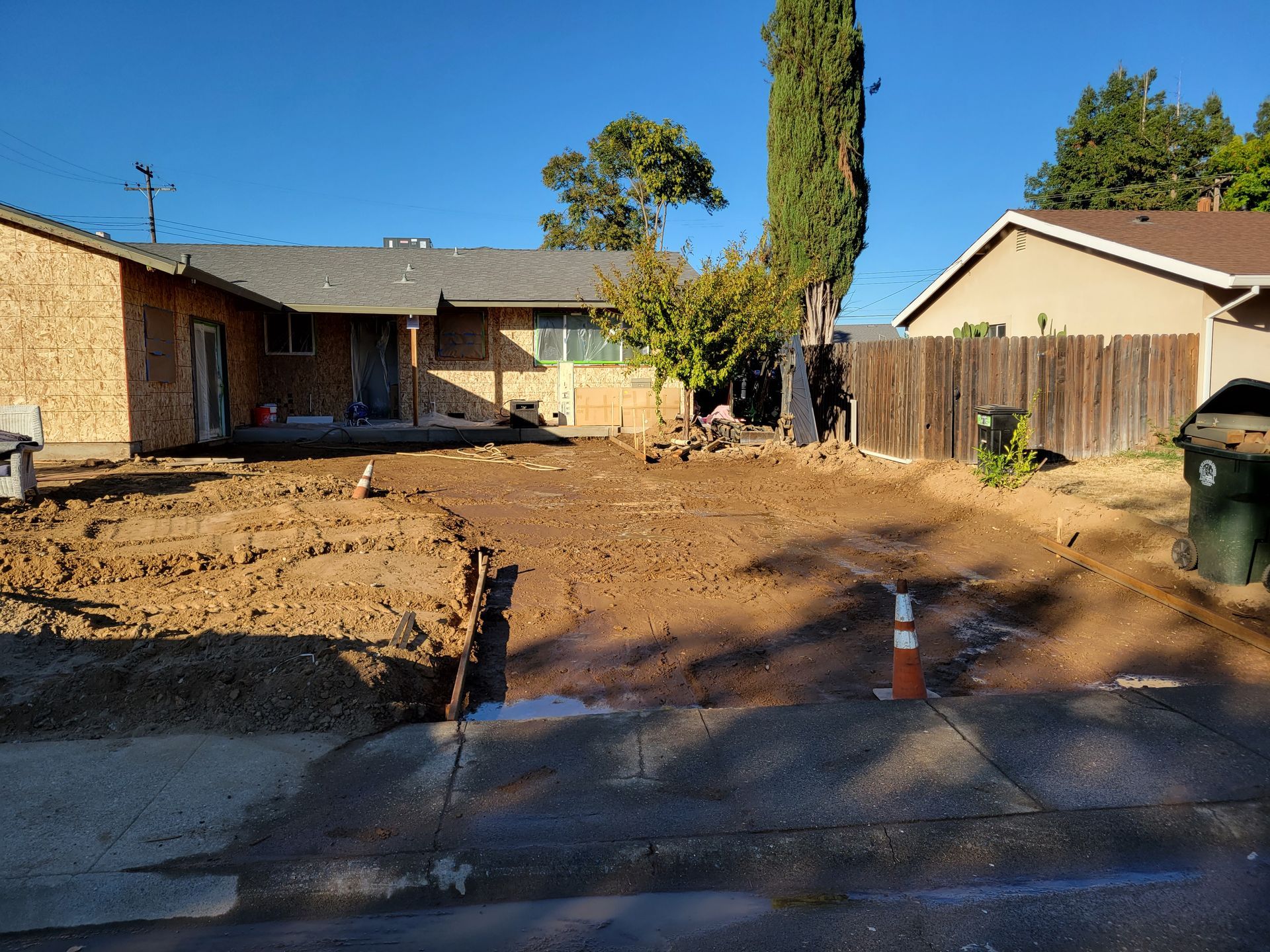 A house with a lot of dirt in front of it
