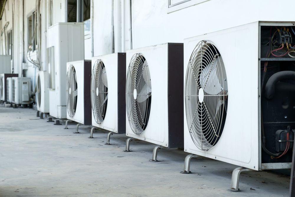 A Row Of Air Conditioners Are Lined Up Outside Of A Building — Firewerx In Dubbo, NSW