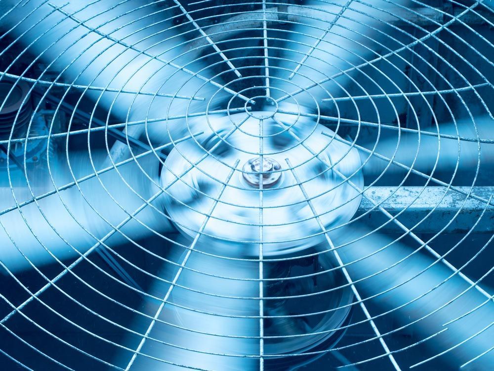 A Close Up Of A Fan With A Blue Background — Firewerx In Dubbo, NSW