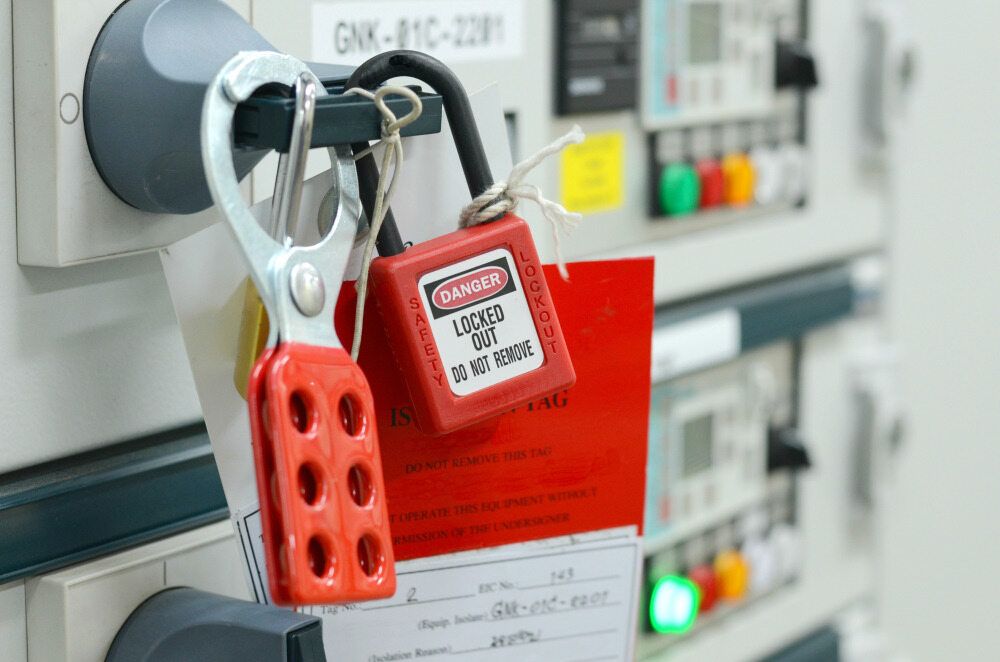 A Red Padlock Is Hanging On A Electrical Box — Firewerx In Parkes, NSW