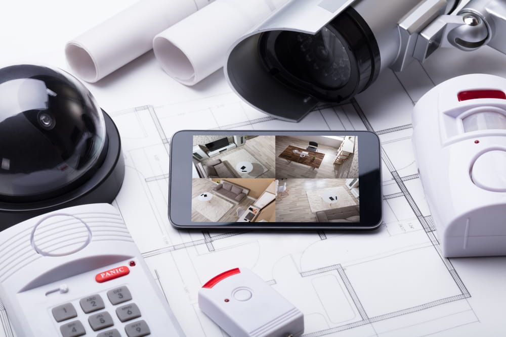 A security system is sitting on top of a blueprint — Firewerx In Dubbo, NSW
