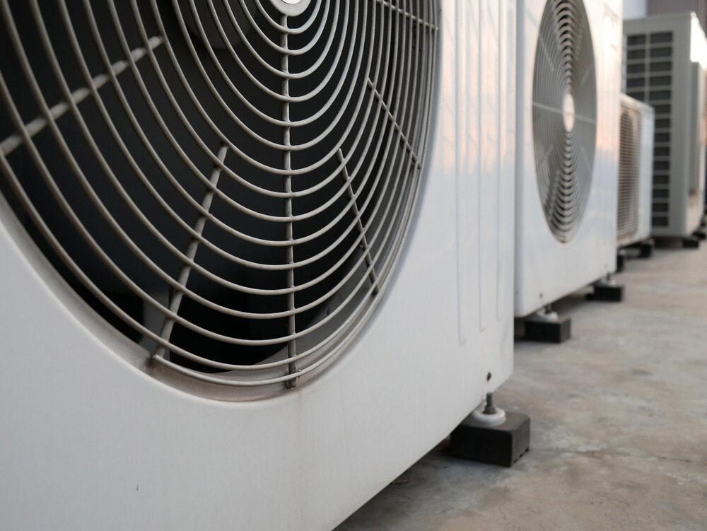 A Row Of Air Conditioners Are Lined Up On The Ground — Firewerx In Orange, NSW