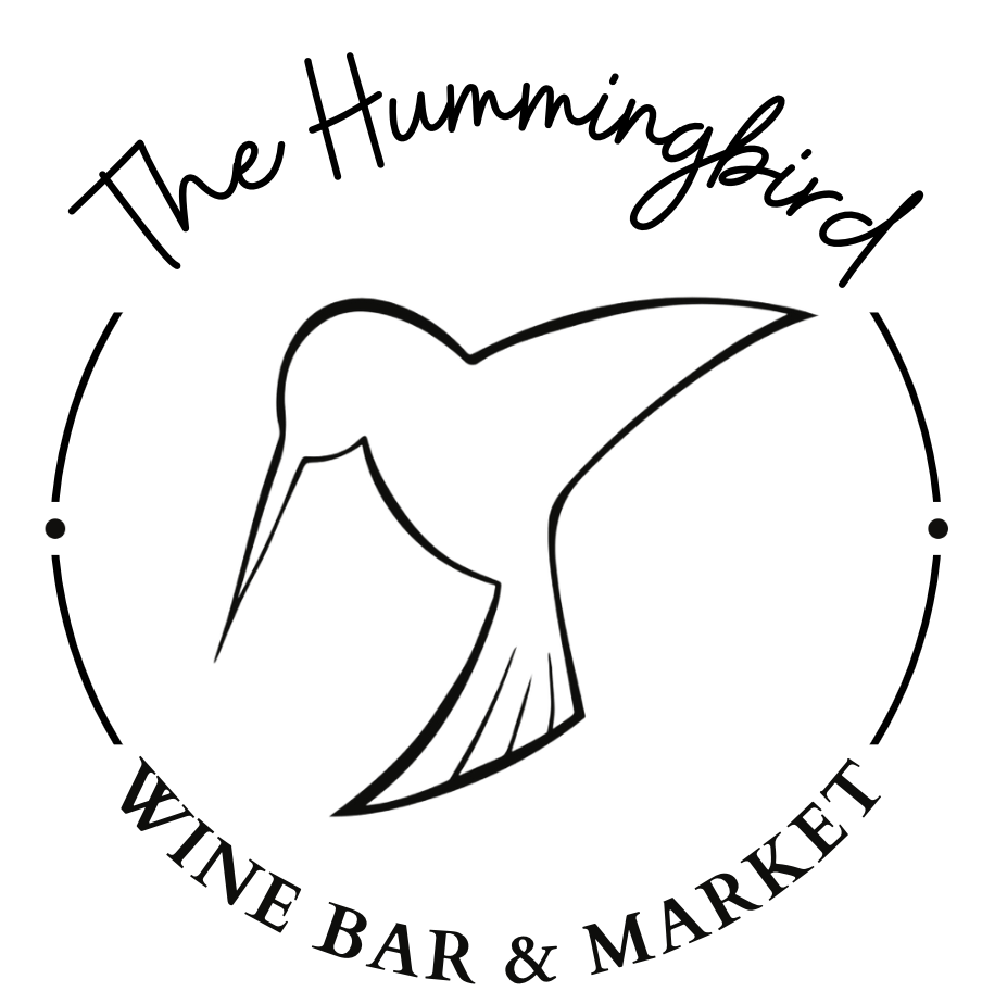 Logo for The Hummingbird Wine Bar & Market; hummingbird silhouette inside a circle with text.