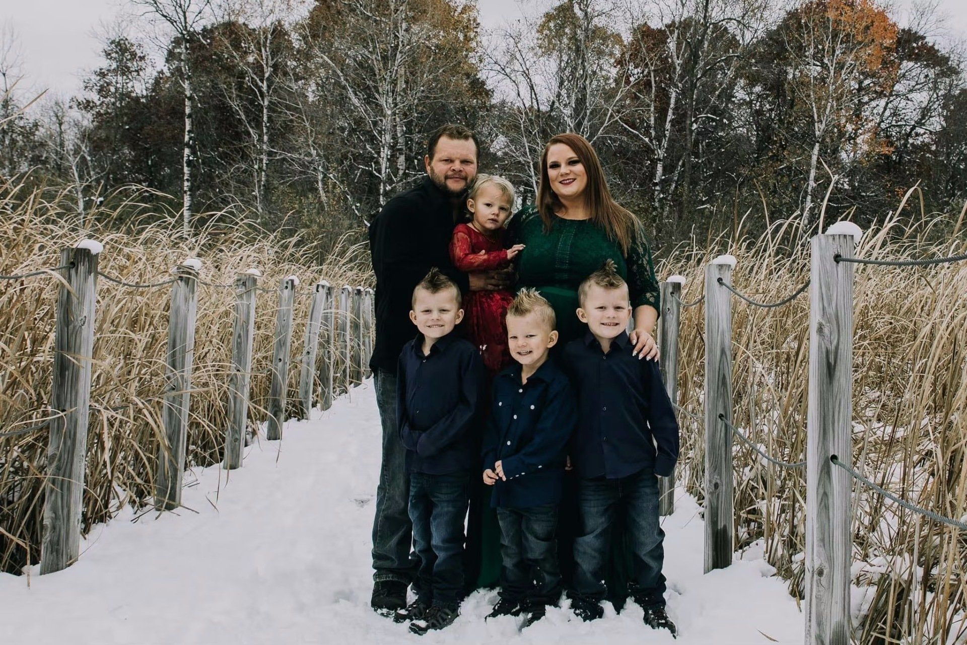 smiling family in the snow