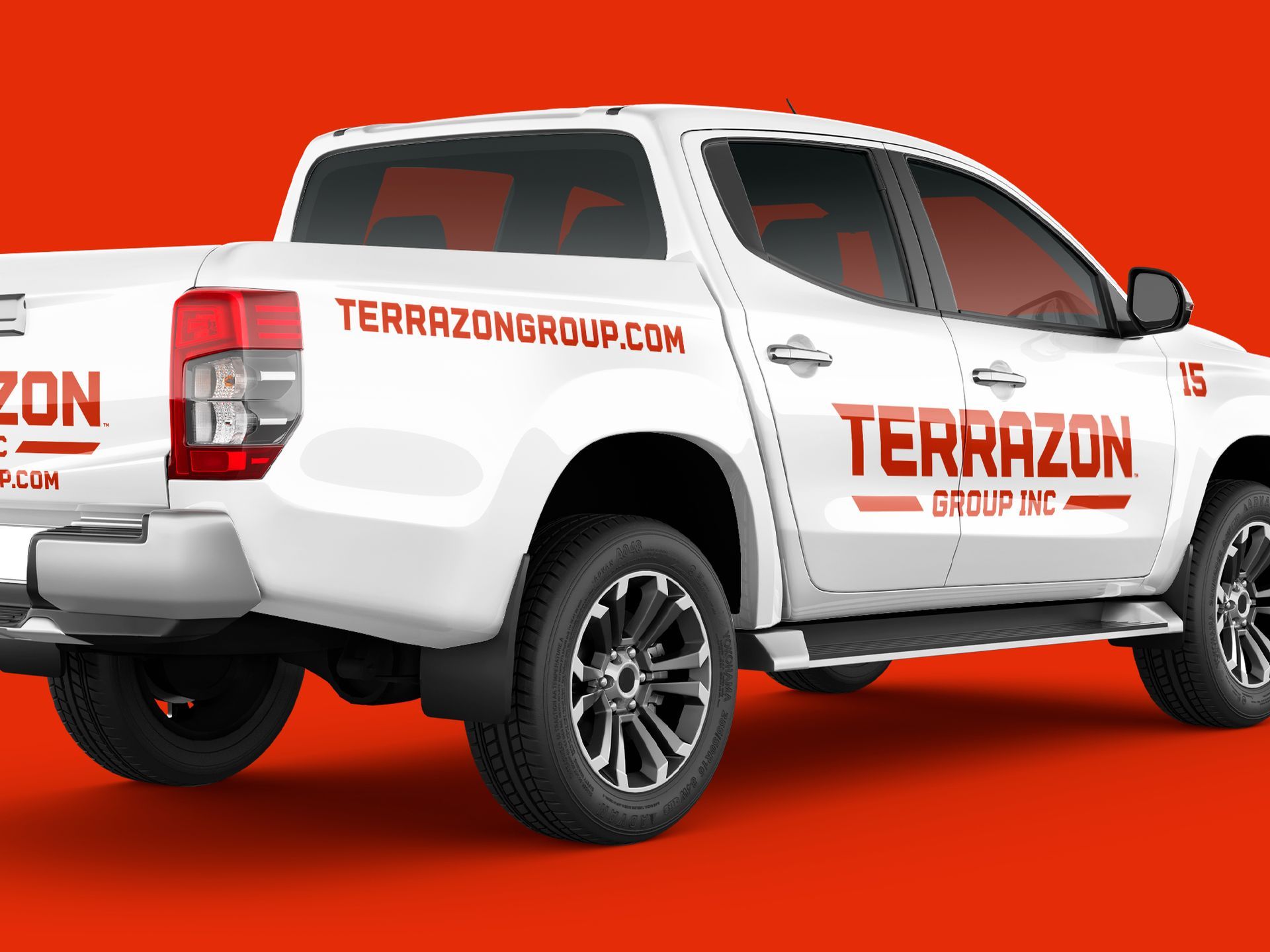 White pickup truck with Terrazon Group branding on a orange background