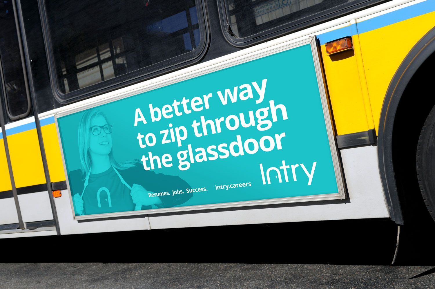 Bus ad with teal sign reading “A better way to zip through the classroom” and Intry logo