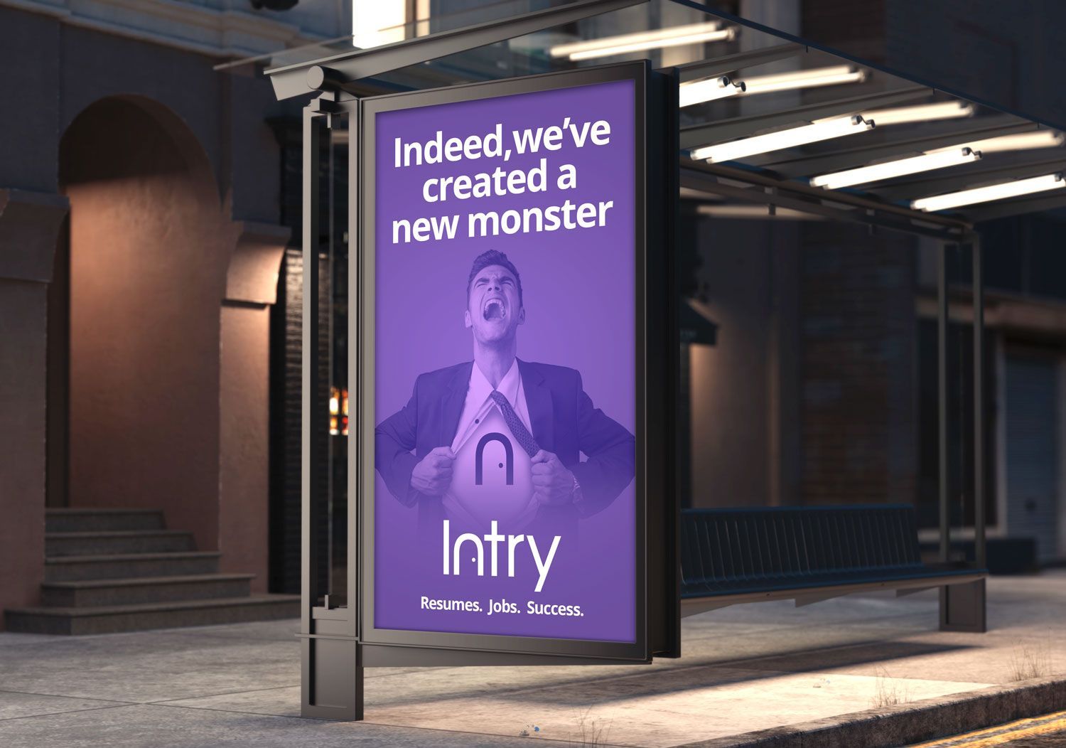 Purple Intry ad on a bus shelter at night, reading “Indeed, we’ve created a new monster.”