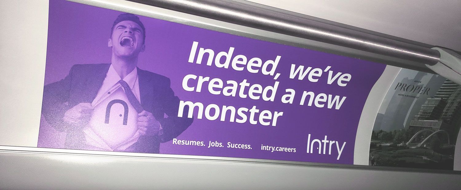 Purple billboard with a man and the text, “Indeed, we created a new monster.”
