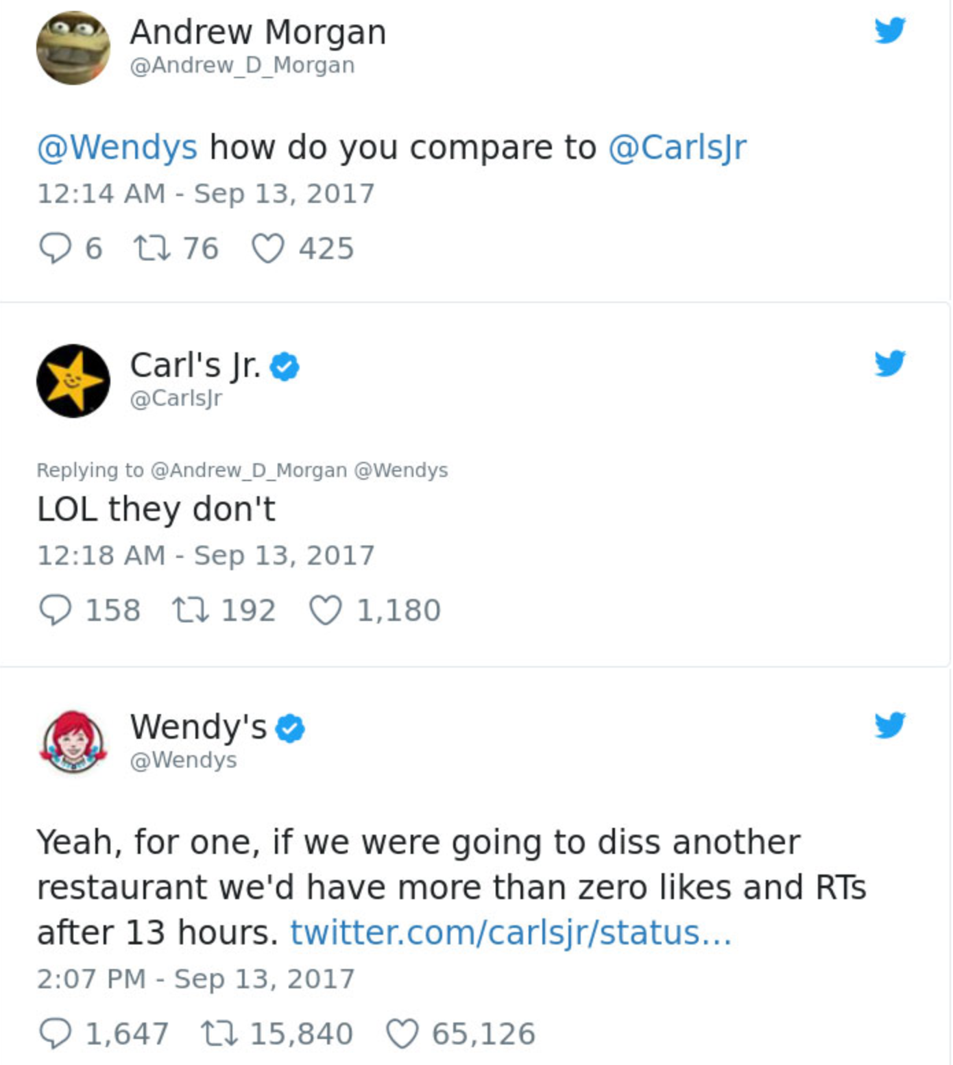 A row of tweets from wendy 's and carl 's jr.