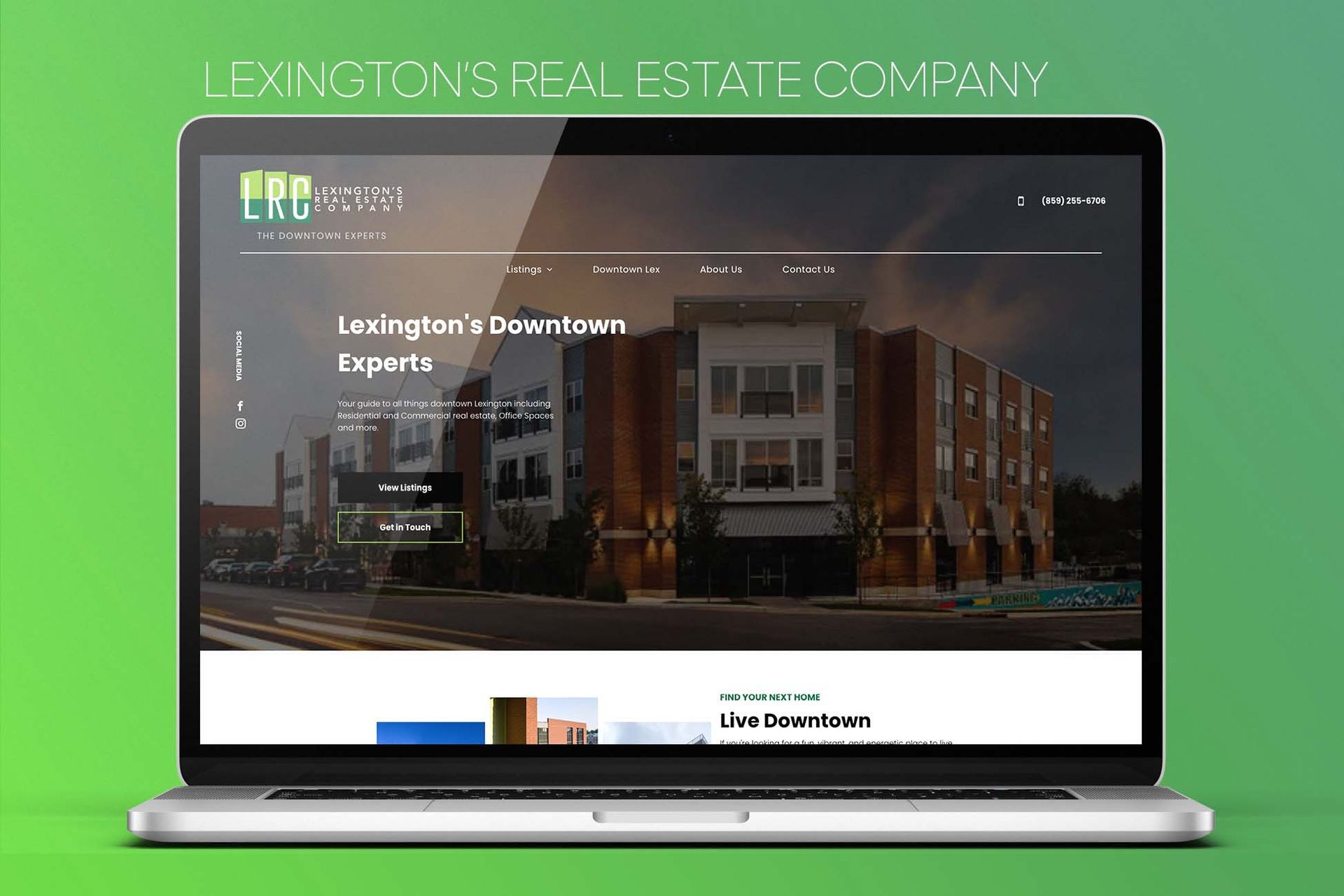 A laptop computer is open to a website for lexington 's real estate company.