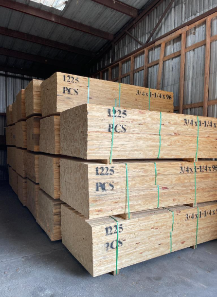 A warehouse filled with stacks of wooden boxes labeled 1235 pcs