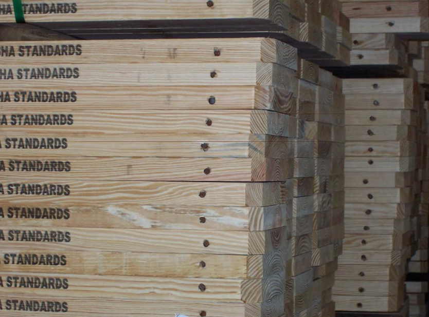A stack of wooden boxes with the word standards on them