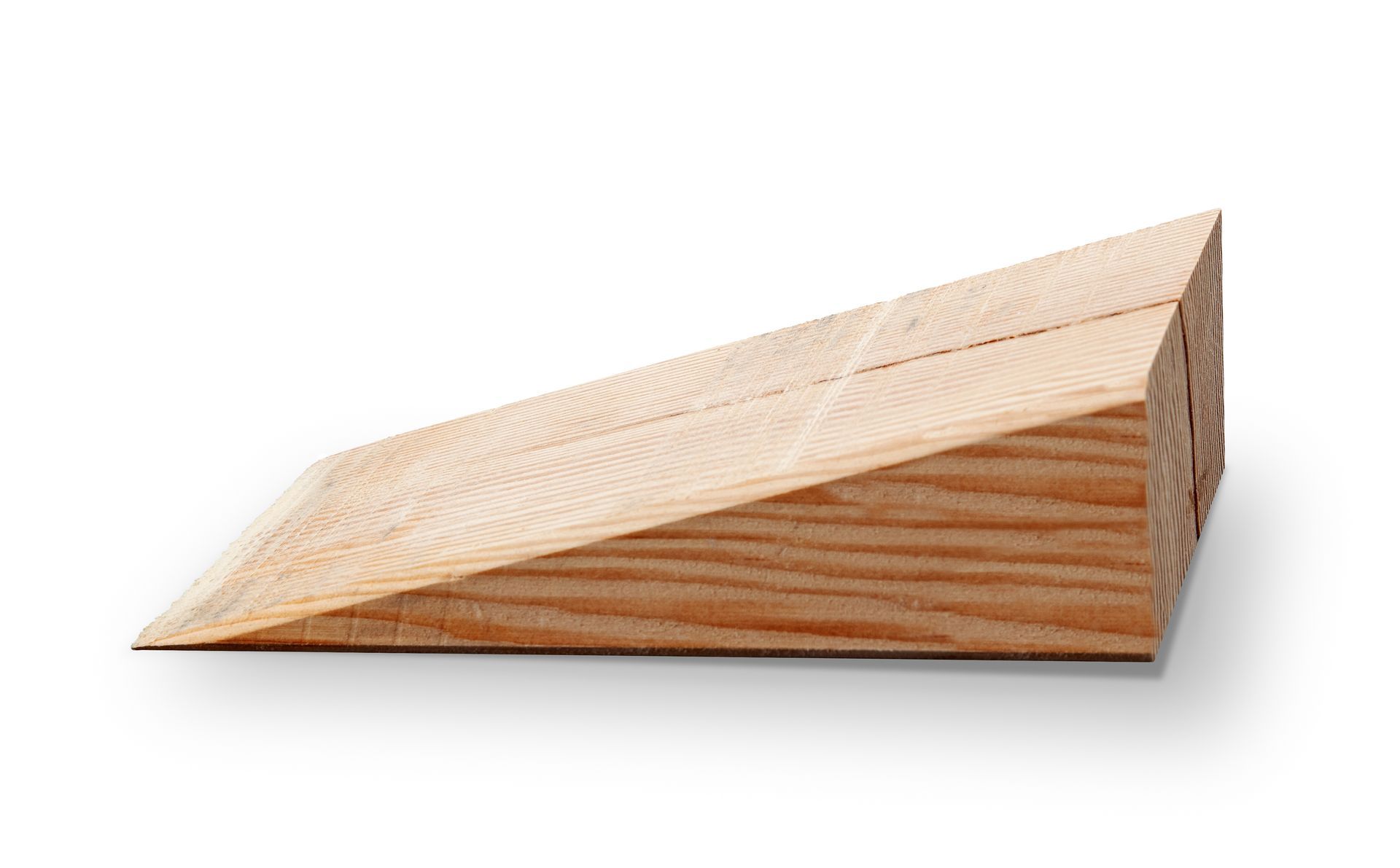 A wooden wedge is sitting on a white surface.