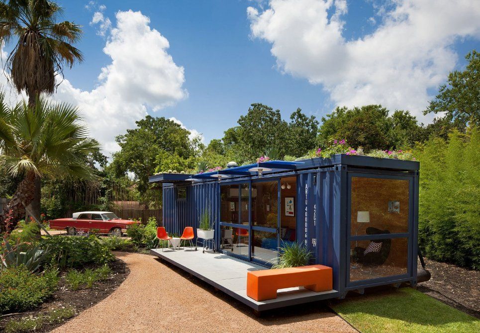 A Blue House with A Red Car Parked in Front of It — Leader Removals & Storage in Albury, NSW