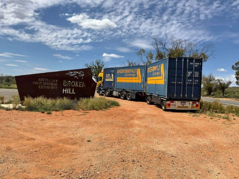 Trucks Are Parked in Front of a Sign That Says Broker Hill — Leader Removals & Storage in Gold Coast, QLD