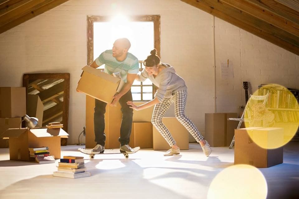 A Man and A Woman Are Moving Into a New House — Leader Removals & Storage in Wodonga,VIC