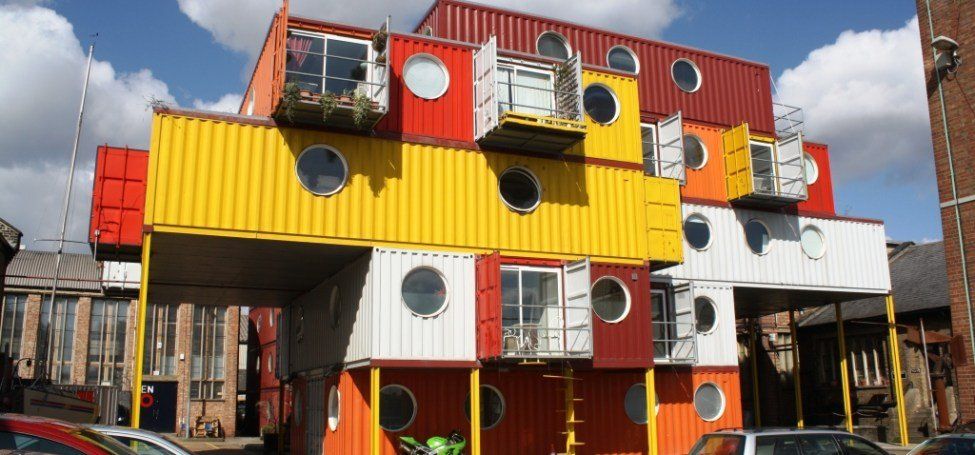 A Building Made out Of Shipping Containers with A Lot of Windows — Leader Removals & Storage in Wodonga,VIC