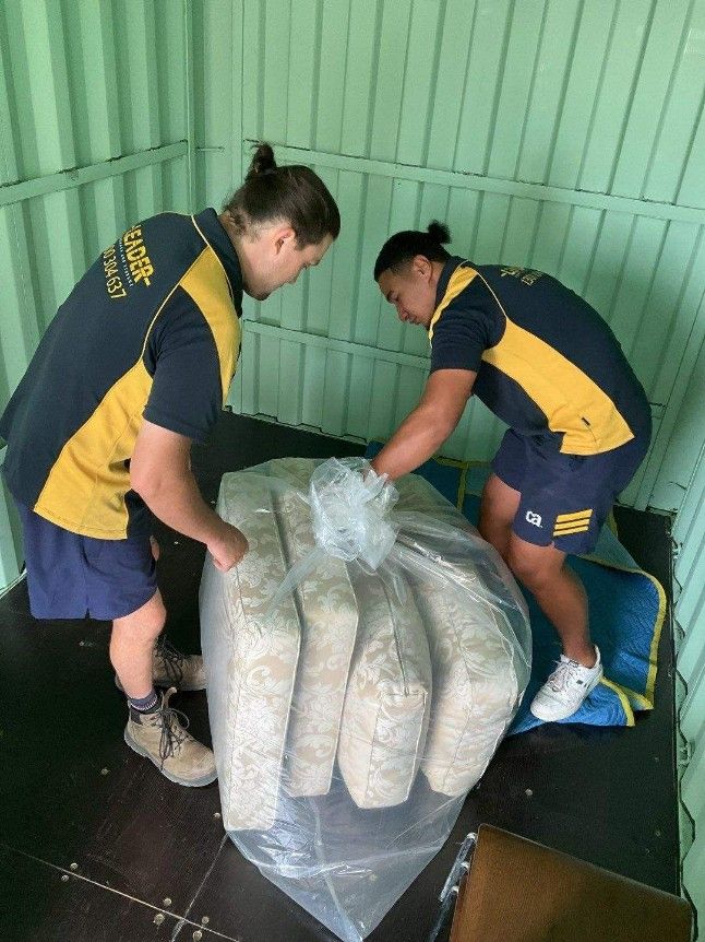 They Are Working on a Large Bag of Cushion — Leader Removals & Storage in Brisbane, QLD
