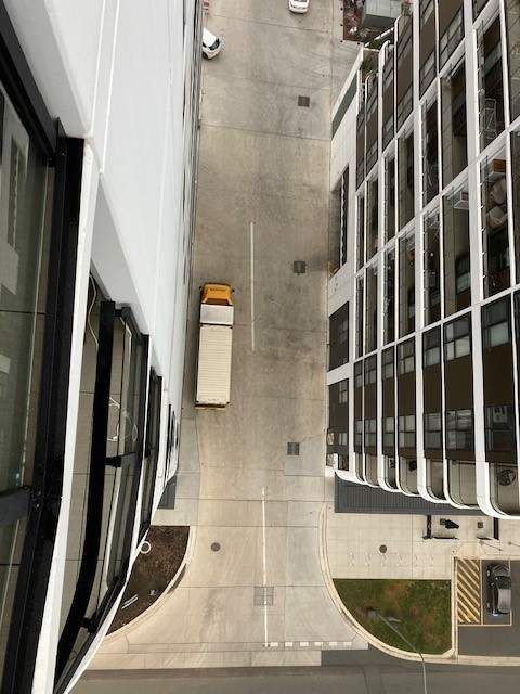 A Truck is Parked on the Side of the Road in Front of a Building — Leader Removals & Storage in Bowral, NSW