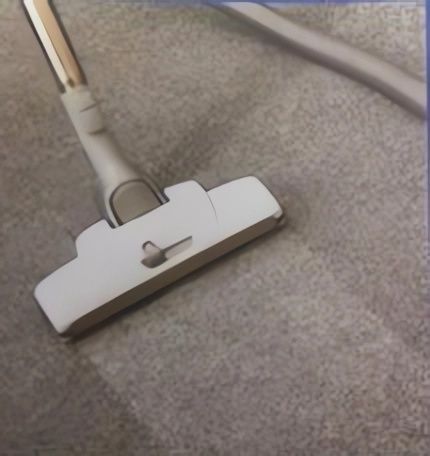 A Vacuum Cleaner Is Being Used to Clean a Carpet — Leader Removals & Storage in Mitchell, ACT