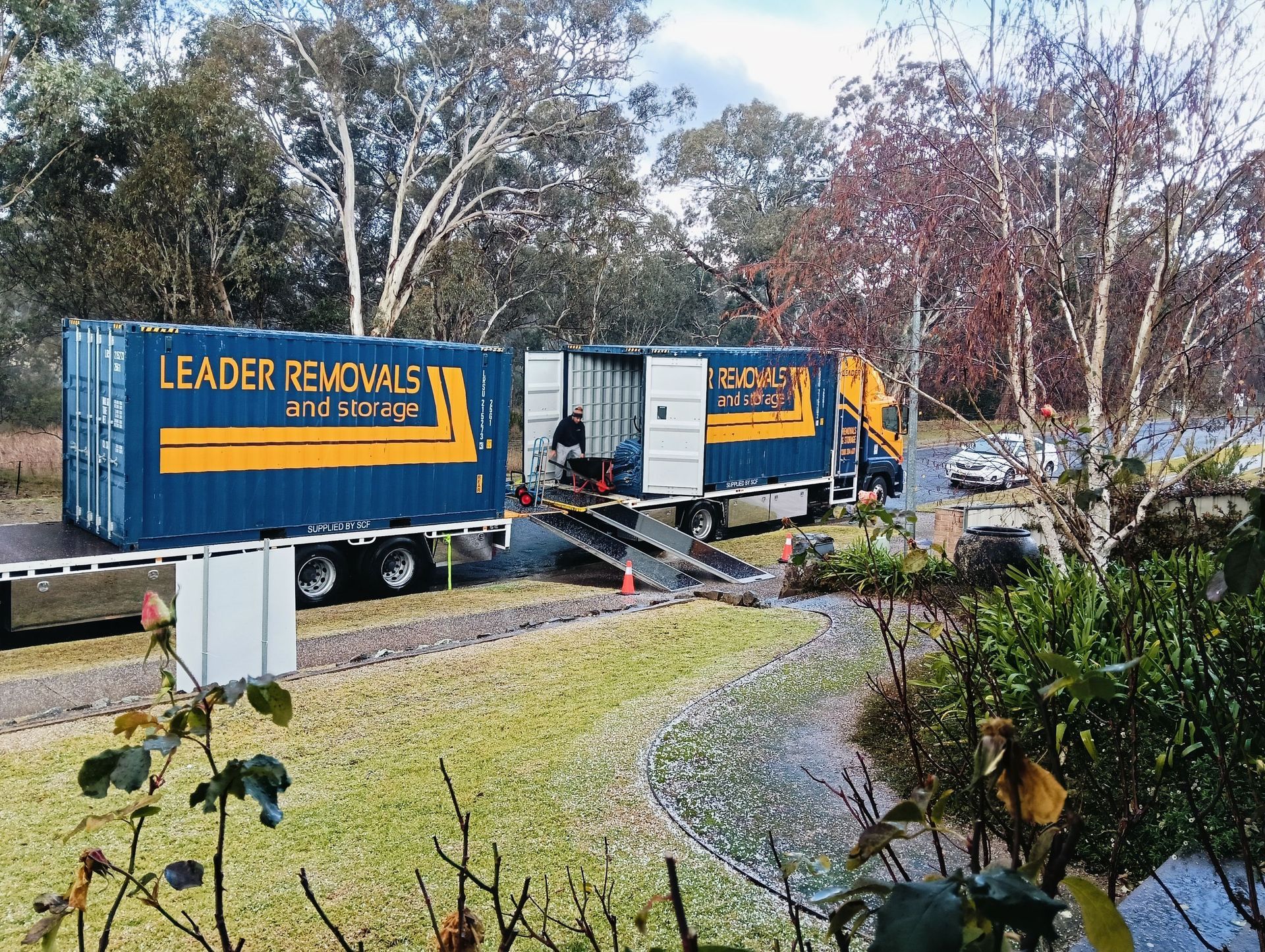 A Row of Leaders Removals Trucks Parked Next to Each Other — Leader Removals & Storage in Mitchell, ACT