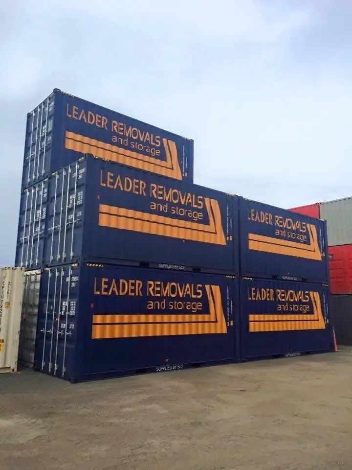 A Stack of Blue Containers with The Words Leader Removals and Storage on Them — Leader Removals & Storage in Wagga Wagga, NSW
