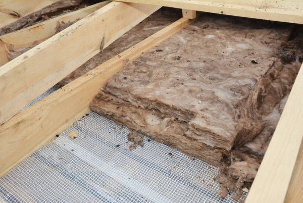 A piece of insulation is sitting on top of a wooden structure.