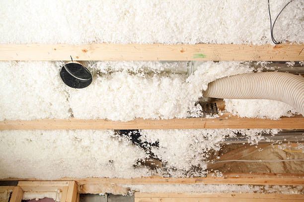 A ceiling with a hose coming out of it.