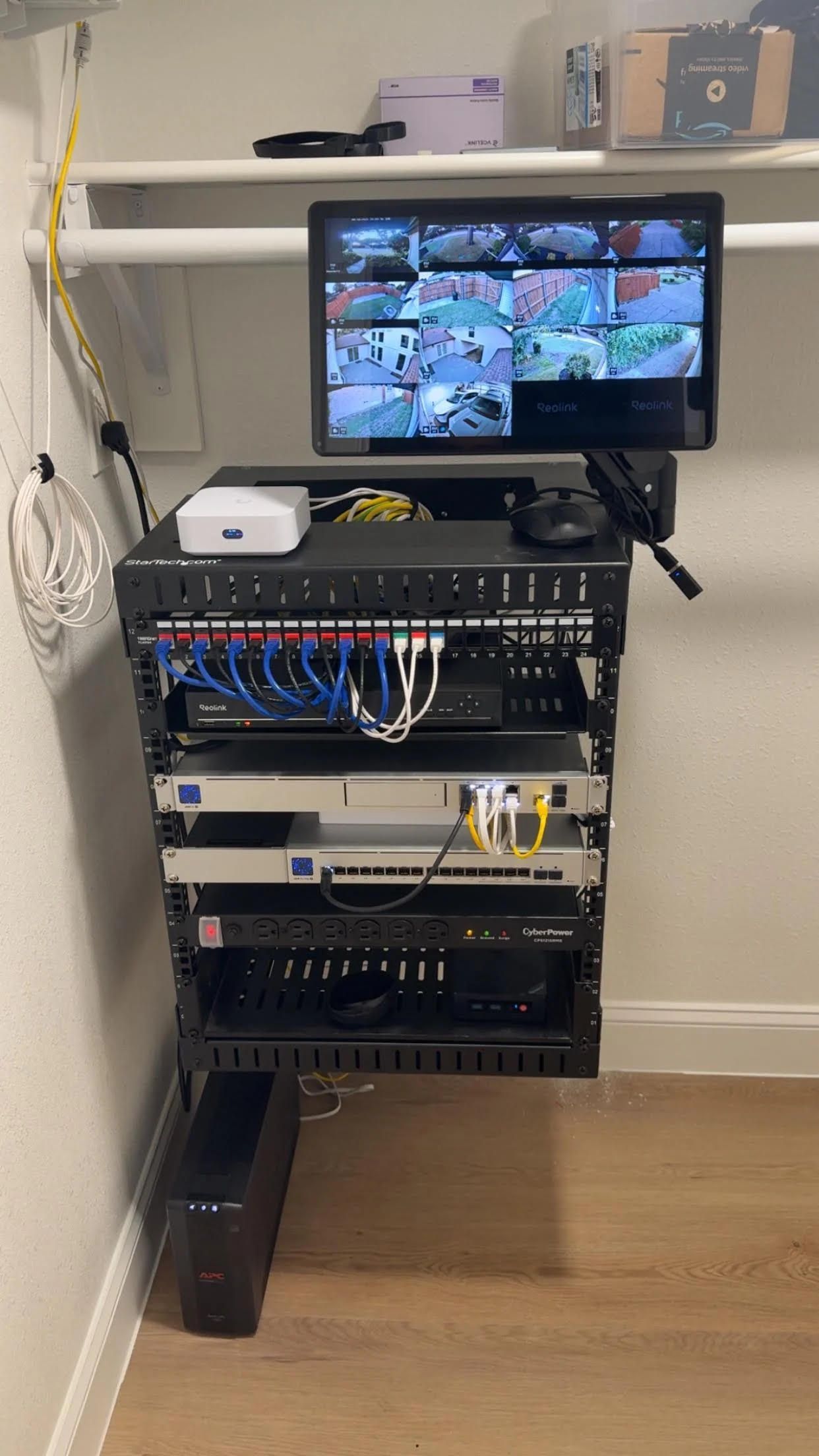 Network server rack with rows of PBI modules and bundled white and blue cables connected to ports