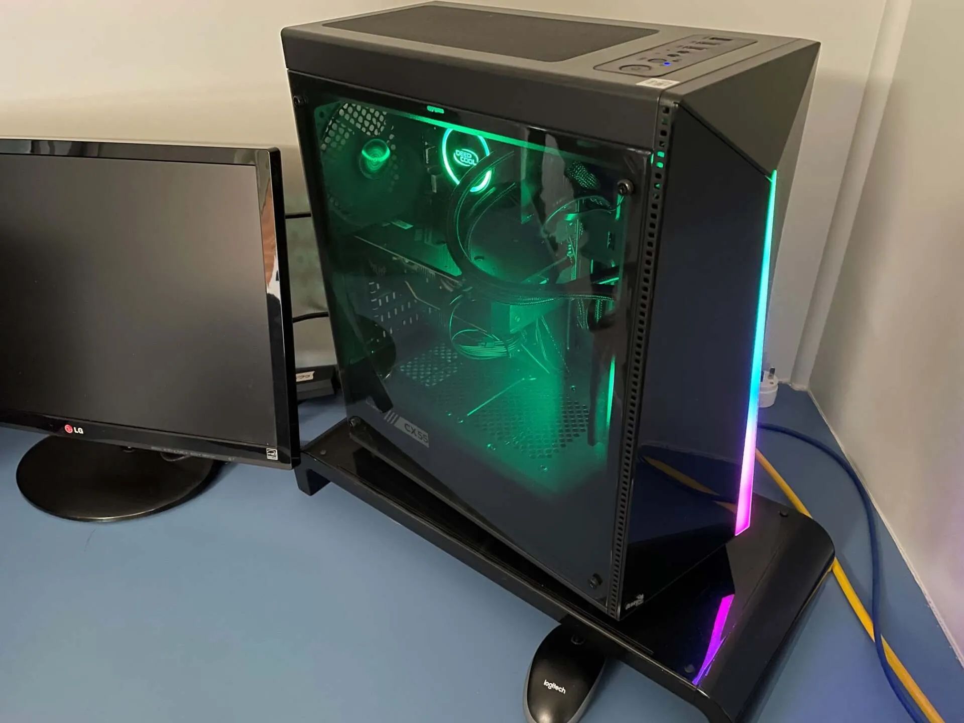 A Computer is Sitting on a Table Next to Two Monitors — Coastal Computing Solutions in Taree, NSW