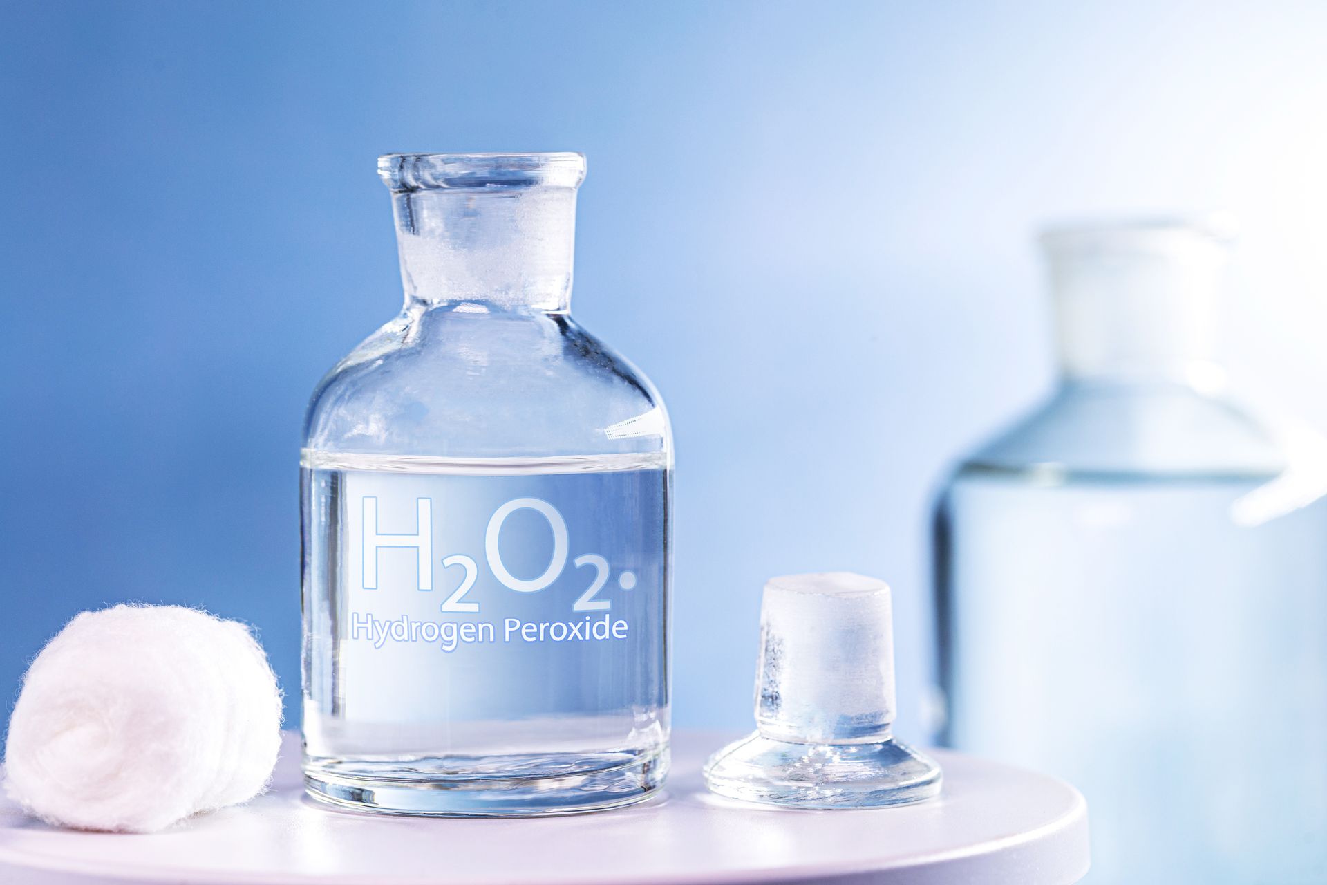 A clear glass bottle labeled 
