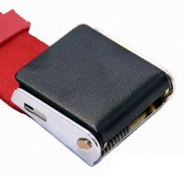 Black tape measure with red strap on a white background