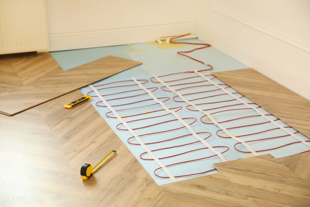 Herringbone Wood Floor with In-Floor Heating System Installation — Illawarra Underfloor Heating In Shellharbour, NSW
