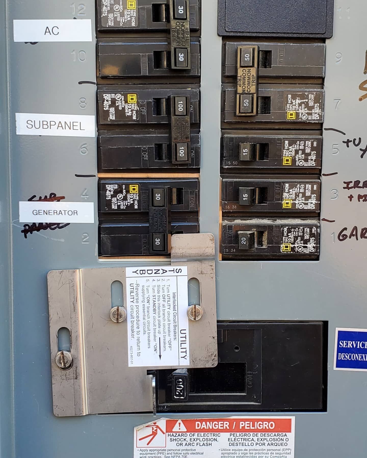 Electrical circuit breaker panel with labeled breakers.