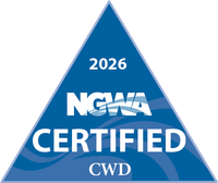Blue triangle badge reading