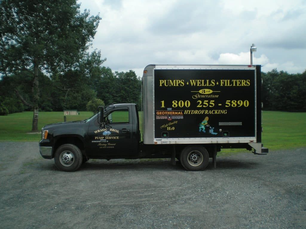 A truck that says pumps wells filters on it