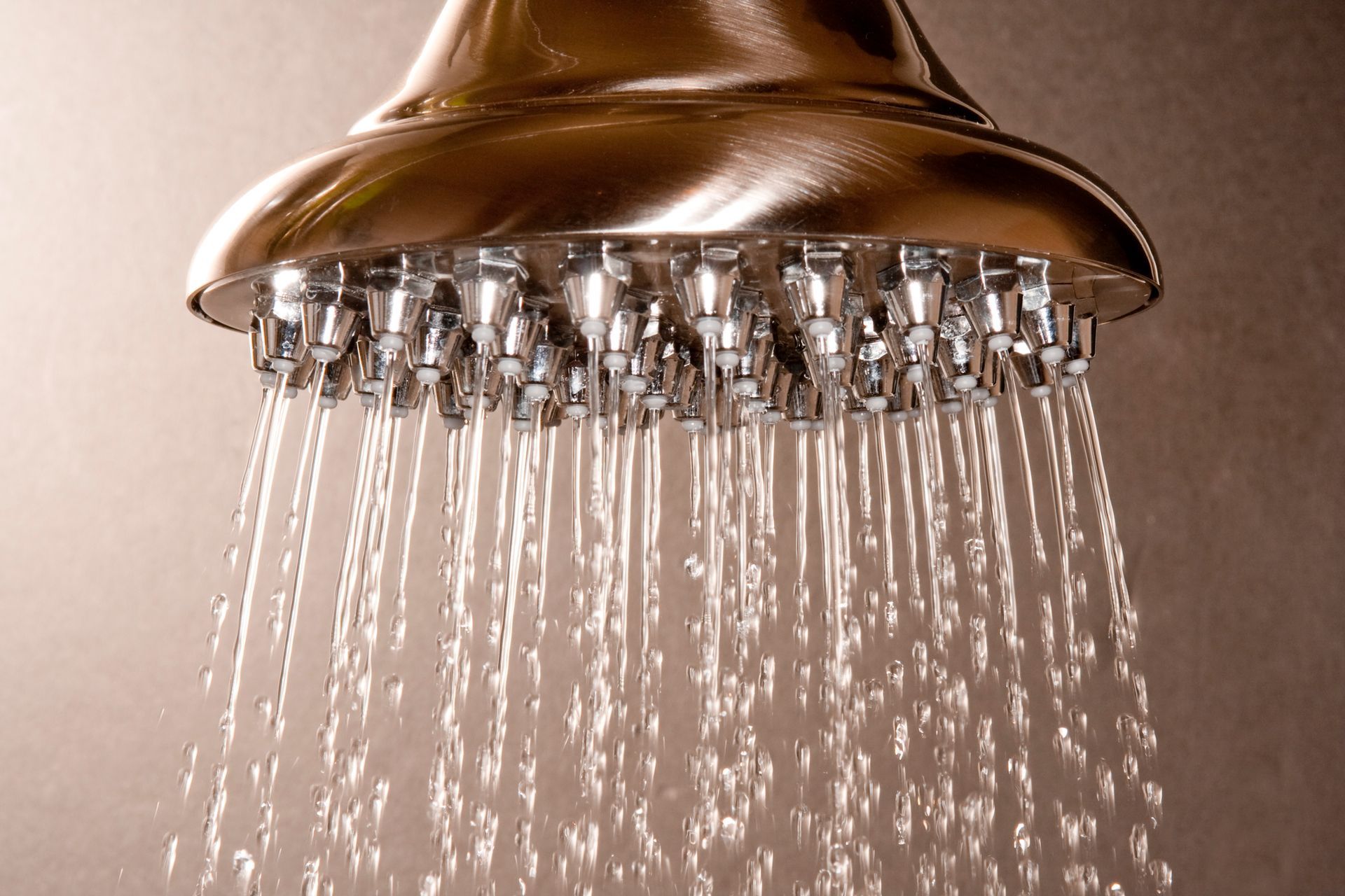 A shower head with water coming out of it