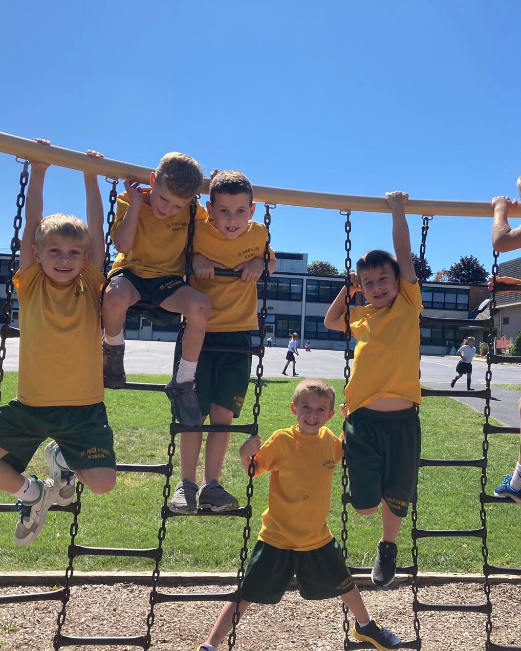 A group of young boys are playing on a playground