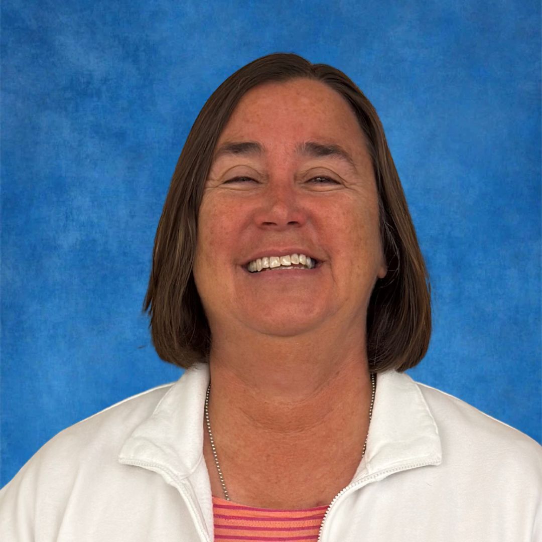 A woman wearing a lanyard with the word philip on it