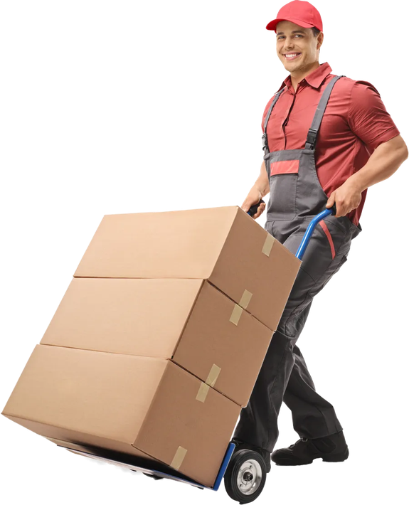 A person in a red uniform and cap smiling while pushing a hand truck loaded with three cardboard boxes.
