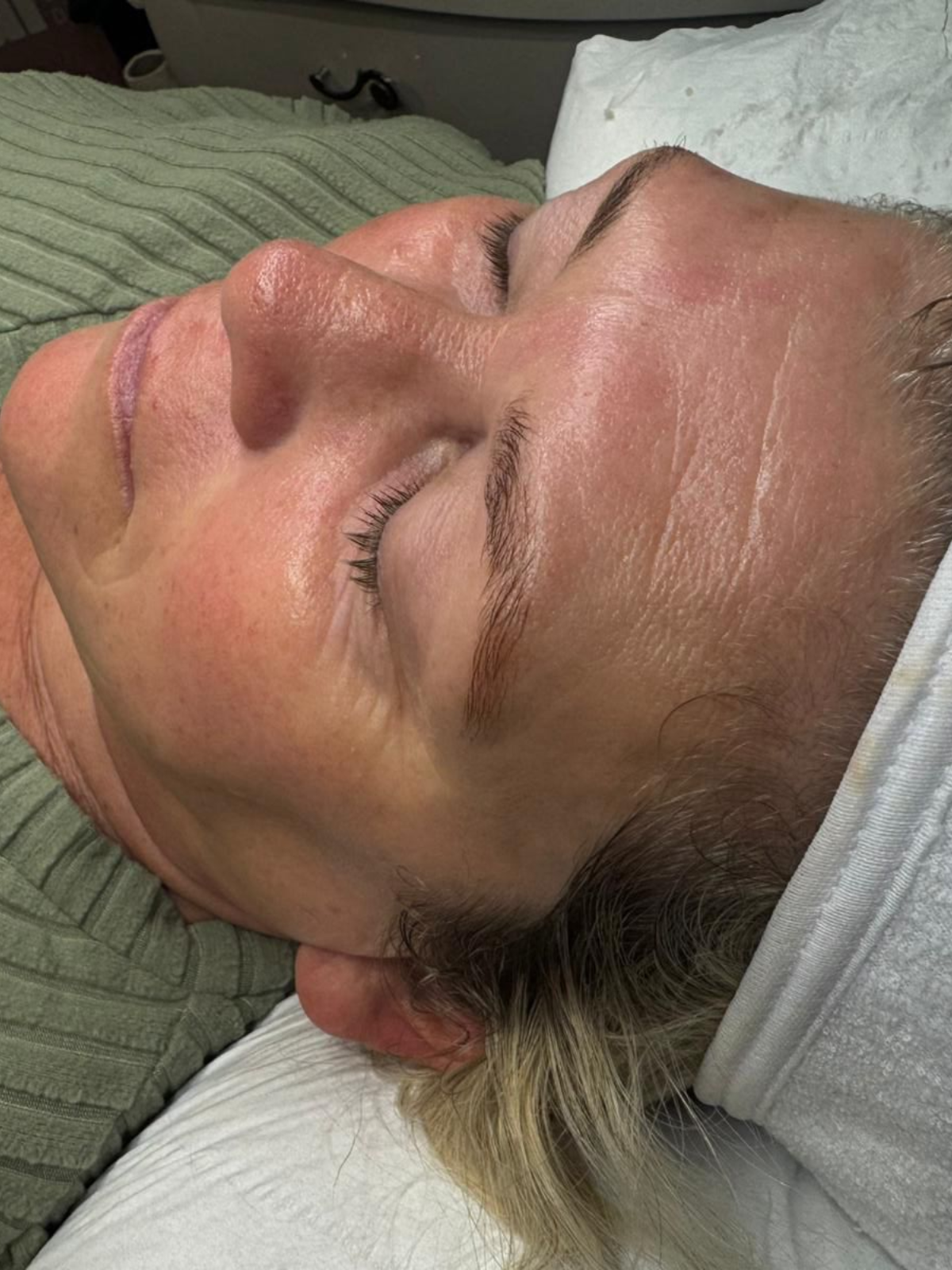 Client relaxing with a headband on after a skin treatment at Claws Nail and Beauty