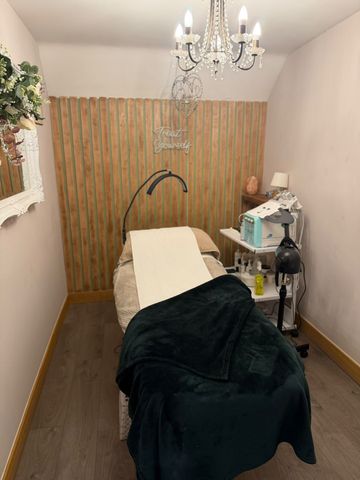 Facial treatment room at Claws Nail and Beauty in Daventry with treatment bed and skin analysis equipment